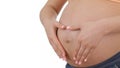 Pregnant woman slides hands over her tummy