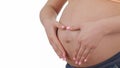Pregnant woman slides hands over her tummy