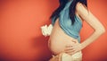 Pregnant woman with small shoes for unborn baby Royalty Free Stock Photo