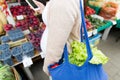 Pregnant woman with smartphone at street market Royalty Free Stock Photo