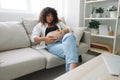 Pregnant woman smile and happiness lies on the couch freedom and strokes her belly with a baby in the last month of Royalty Free Stock Photo