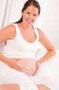 Pregnant woman with smile symbol on it