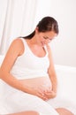 Pregnant woman with smile symbol on it