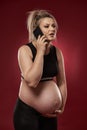 Pregnant woman speaking on phone Royalty Free Stock Photo