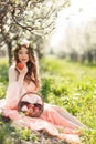 A pregnant woman in a spring garden with basket Royalty Free Stock Photo