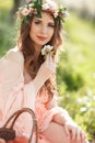 A pregnant woman in a spring garden with basket Royalty Free Stock Photo