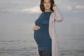 Pregnant Woman Standing Against Ocean Royalty Free Stock Photo