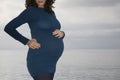 Pregnant Woman Standing Against Ocean Royalty Free Stock Photo