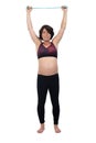 Pregnant woman standing doing exercise