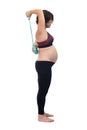 Pregnant woman standing doing exercise
