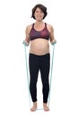 Pregnant woman standing doing exercise resistance bands on white background
