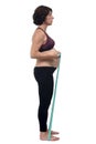 Pregnant woman standing doing exercise