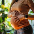 Pregnant Woman With Hands on Stomach Royalty Free Stock Photo
