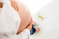 Pregnant woman standing on scales to control weight gain Royalty Free Stock Photo