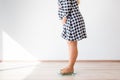 Pregnant woman standing on scales to control weight gain Royalty Free Stock Photo