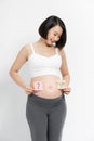 Pregnant woman with stick notes on her belly Royalty Free Stock Photo