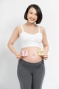 Pregnant woman with stick notes on her belly Royalty Free Stock Photo