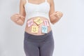 Pregnant woman with stick notes on her belly Royalty Free Stock Photo