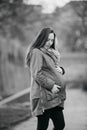 Pregnant woman sticks behind belly