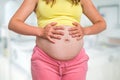 Pregnant woman with stomach ache - pregnancy concept