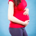 Pregnant woman with stomach pain touching her belly, aches in pregnancy and risk of miscarriage Royalty Free Stock Photo