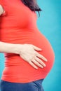 Pregnant woman with stomach pain touching her belly, aches in pregnancy and risk of miscarriage Royalty Free Stock Photo