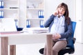 The pregnant woman struggling to do work in office Royalty Free Stock Photo