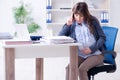 The pregnant woman struggling to do work in office Royalty Free Stock Photo