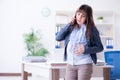 The pregnant woman struggling to do work in office Royalty Free Stock Photo