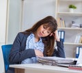 Pregnant woman struggling to do work in office Royalty Free Stock Photo