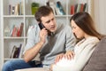 Pregnant woman suffering and husband calling to doctor