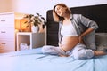 Pregnant woman suffering lower back pain or headache Royalty Free Stock Photo