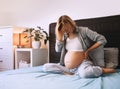 Pregnant woman suffering lower back pain or headache Royalty Free Stock Photo