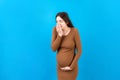 Pregnant woman suffering from toxicosis. Toxicosis Of Pregnancy. Pregnant Lady Feeling Sick Having Nausea Standing On Colored Royalty Free Stock Photo