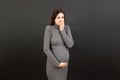 Pregnant woman suffering from toxicosis. Toxicosis Of Pregnancy. Pregnant Lady Feeling Sick Having Nausea Standing On Colored Royalty Free Stock Photo