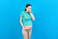 Pregnant woman suffering from toxicosis. Toxicosis Of Pregnancy. Pregnant Lady Feeling Sick Having Nausea Standing On Royalty Free Stock Photo