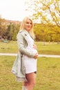 Pregnant woman on a sunny day outdoors Royalty Free Stock Photo