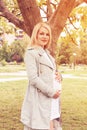 Pregnant woman on a sunny day outdoors Royalty Free Stock Photo