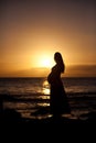 Pregnant woman at sunset Royalty Free Stock Photo