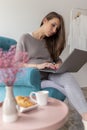 Pregnant woman surfing the net using laptop computer Royalty Free Stock Photo