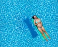 Pregnant woman swim in the pool on matrass