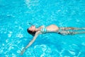 Pregnant woman swim relaxing in the swimming pool Royalty Free Stock Photo