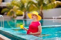 Pregnant woman in swimming pool. Healthy pregnancy Royalty Free Stock Photo