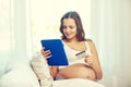 Pregnant woman with tablet pc and credit card Royalty Free Stock Photo