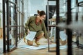 Pregnant woman taking documents from the floor after dropping them Royalty Free Stock Photo