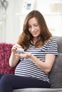 Pregnant Woman Taking Folic Acid Tablets Royalty Free Stock Photo