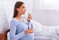 Pregnant Woman Taking Medicine Pill Holding Water Glass In Bed Royalty Free Stock Photo