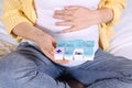 Pregnant woman taking pills on bed, closeup Royalty Free Stock Photo