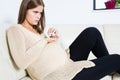 Pregnant woman taking pills Royalty Free Stock Photo