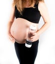 Pregnant woman taking prenatal vitamins and medicinal pills for healthy pregnancy Royalty Free Stock Photo